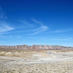 Desert landscape with rocky cliffs in background in Cottonwood Canyon, Utah. 