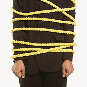 Businessman wrapped in yellow rope