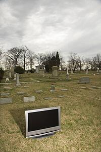Flat panel television set in cemetery