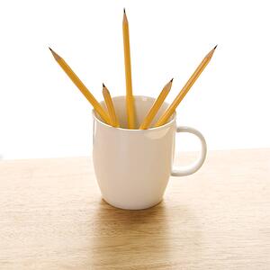 Five pencils in a coffee mug with pointed ends up
