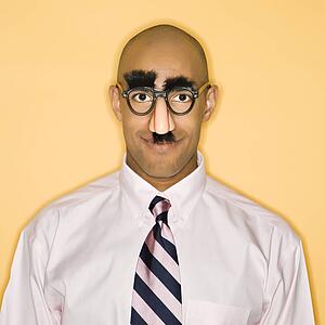 Man wearing groucho mask disguise