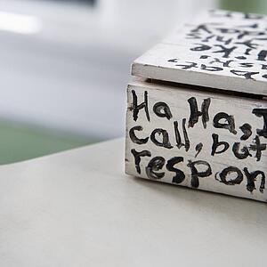 Hand painted box with text starting with ha ha