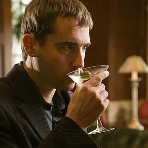 Man drinking martini