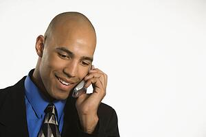 Man in suit talking on cellphone