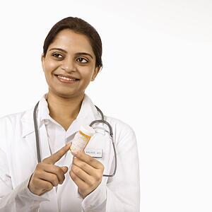 Indian woman doctor explaining medication.