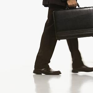 Businessman walking carrying briefcase