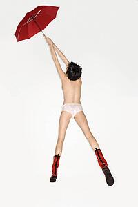 Underwear and red boots floating into the air