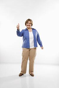 Woman giving thumbs up and smiling 