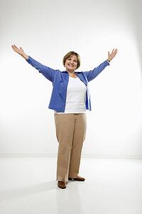 Woman standing with arms in the air 