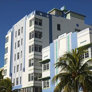 Palm trees and buildings in art deco district of Miami, Florida, USA.