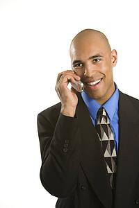 Man in suit talking on cellphone