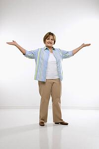Woman standing with arms in the air 
