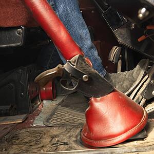 Tractor trailer with gun and holster attached to gear shift