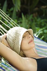 Woman napping in hammock