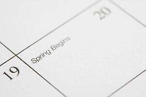 Close up of calendar displaying the beginning of spring