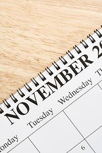 Close up of spiral bound calendar displaying month of November