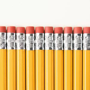 Eraser ends of group of pencils lined up in an even row