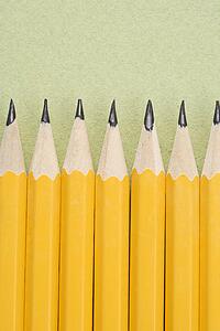 Sharp pencils arranged in an even row