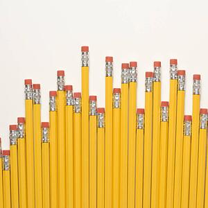 Uneven row of eraser ends of pencils