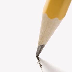Close up of pencil writing on paper