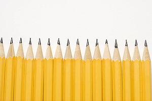 Sharp pencils lined up in an even row