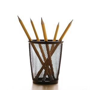 Five pencils in a wire mesh pencil holder