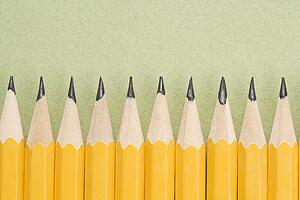 Sharp pencils arranged in an even row