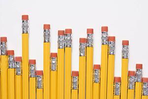 Uneven row of eraser ends of pencils