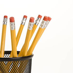 Group of pencils in a pencil holder with eraser ends up