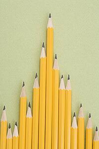 Sharp pencils arranged in an uneven row