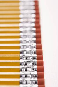 Eraser ends of group of pencils lined up in an even row