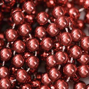 Close up of strings of red beads.