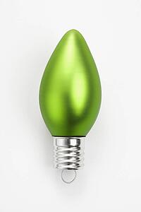 Still life of green Christmas ornament.