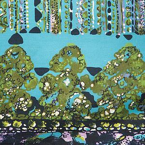 Close-up of colorful vintage fabric with abstract blue and turquoise shapes printed on silk