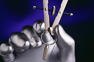 Silver hand holding drafting compass