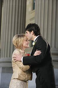Groom kissing his mother