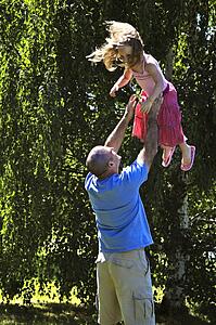 Father being playful with daughter