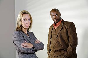 Man and woman looking stern