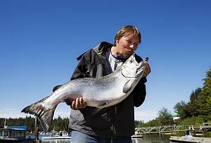 Man kissing his fish