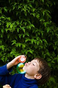 Boy blowing bubbles