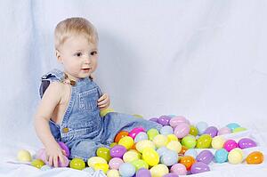 Boy sitting with easter eggs