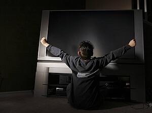 Child sitting in front of television