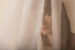 Woman behind a veil