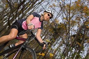 Cyclist on recreational trail in the autumn 
