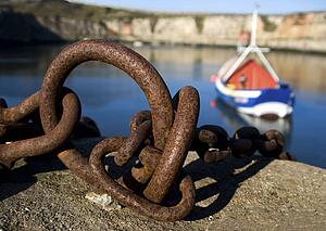 Harbour with mooring and fishing boat 