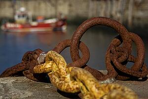 Harbour with mooring and fishing boat 