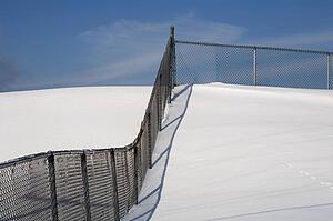 Chain link fence in the snow