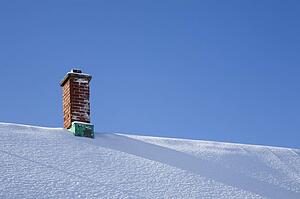 Chimney on a snowy roof