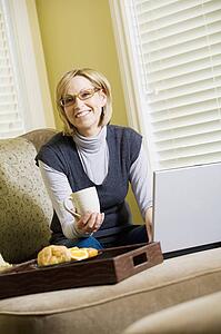 Woman working on laptop computer from home