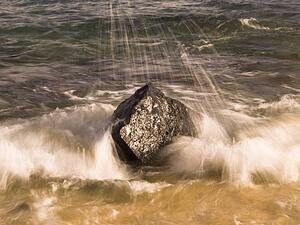 Water splashing on a rock, Poipu, Kauai, Hawaii